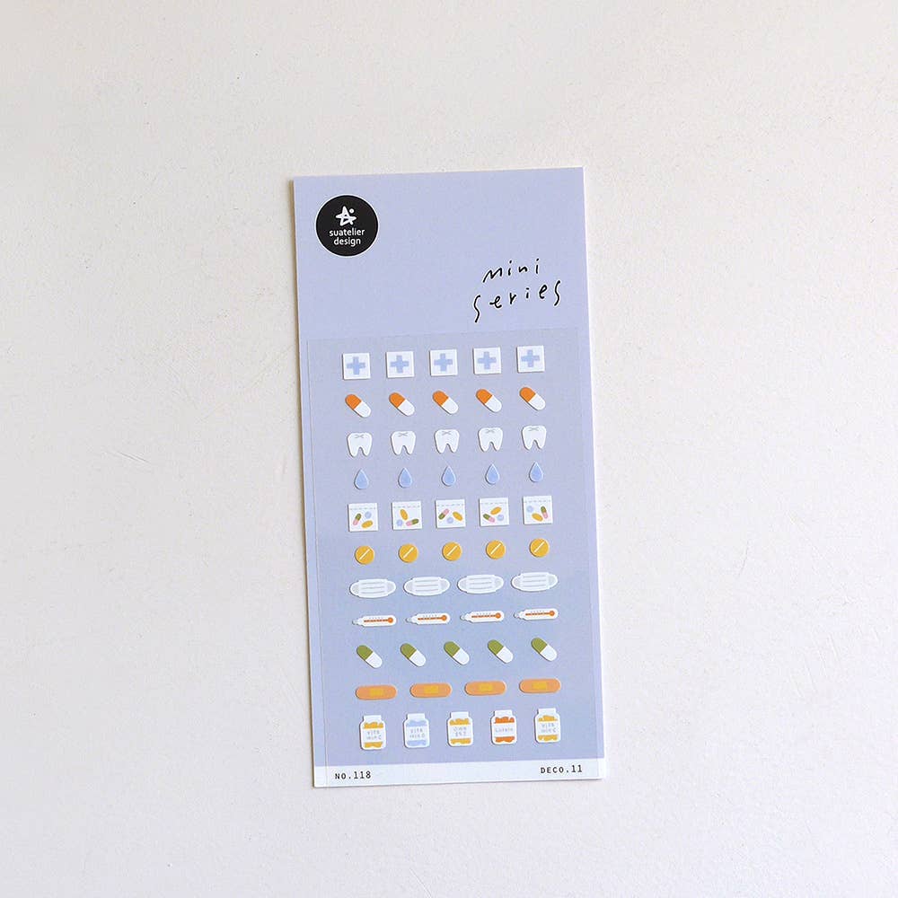 Sheet of small Suatelier stickers with various health and dental designs on a light grey background