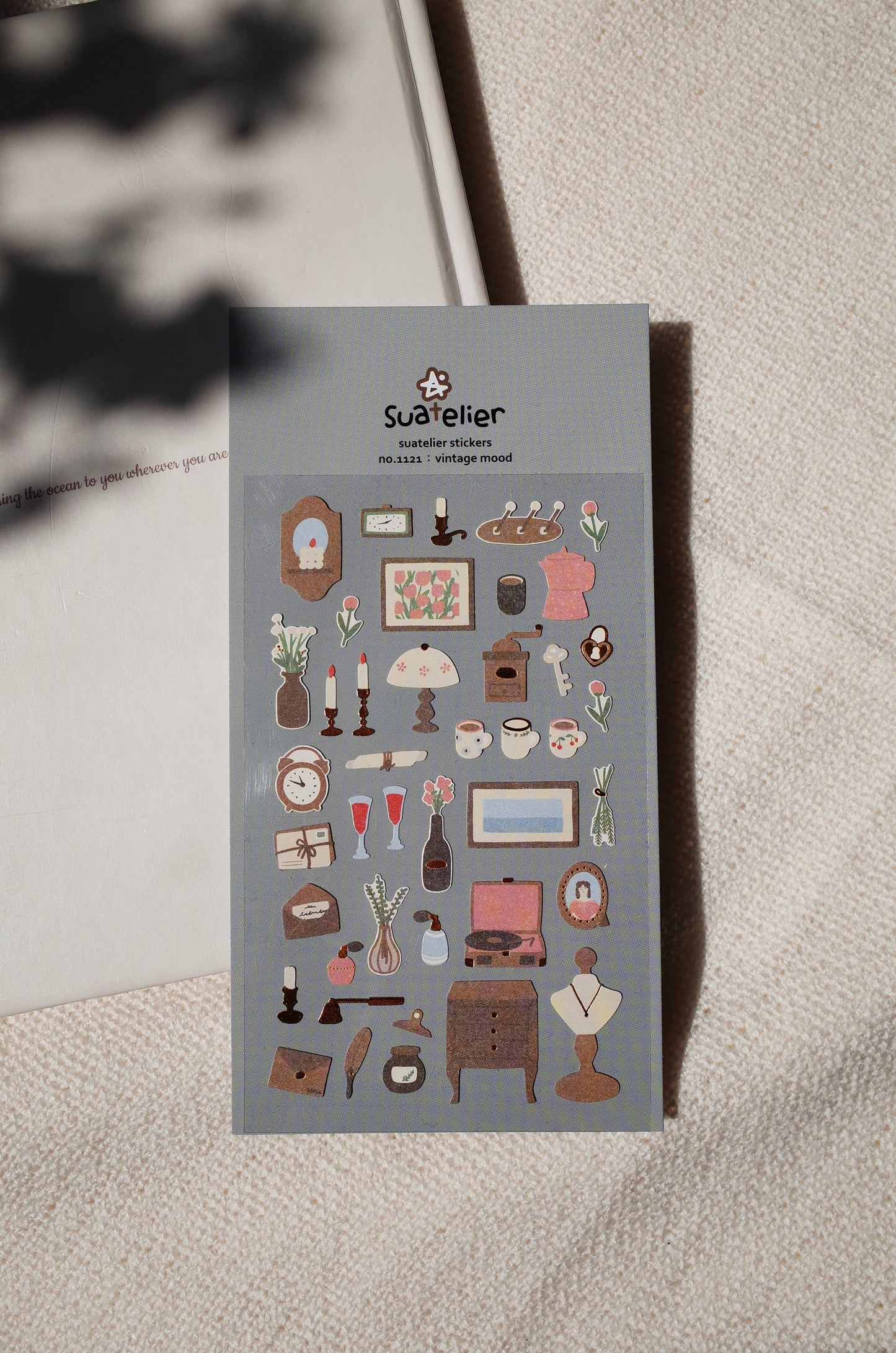 Sticker sheet with vintage-themed illustrations on a textured surface