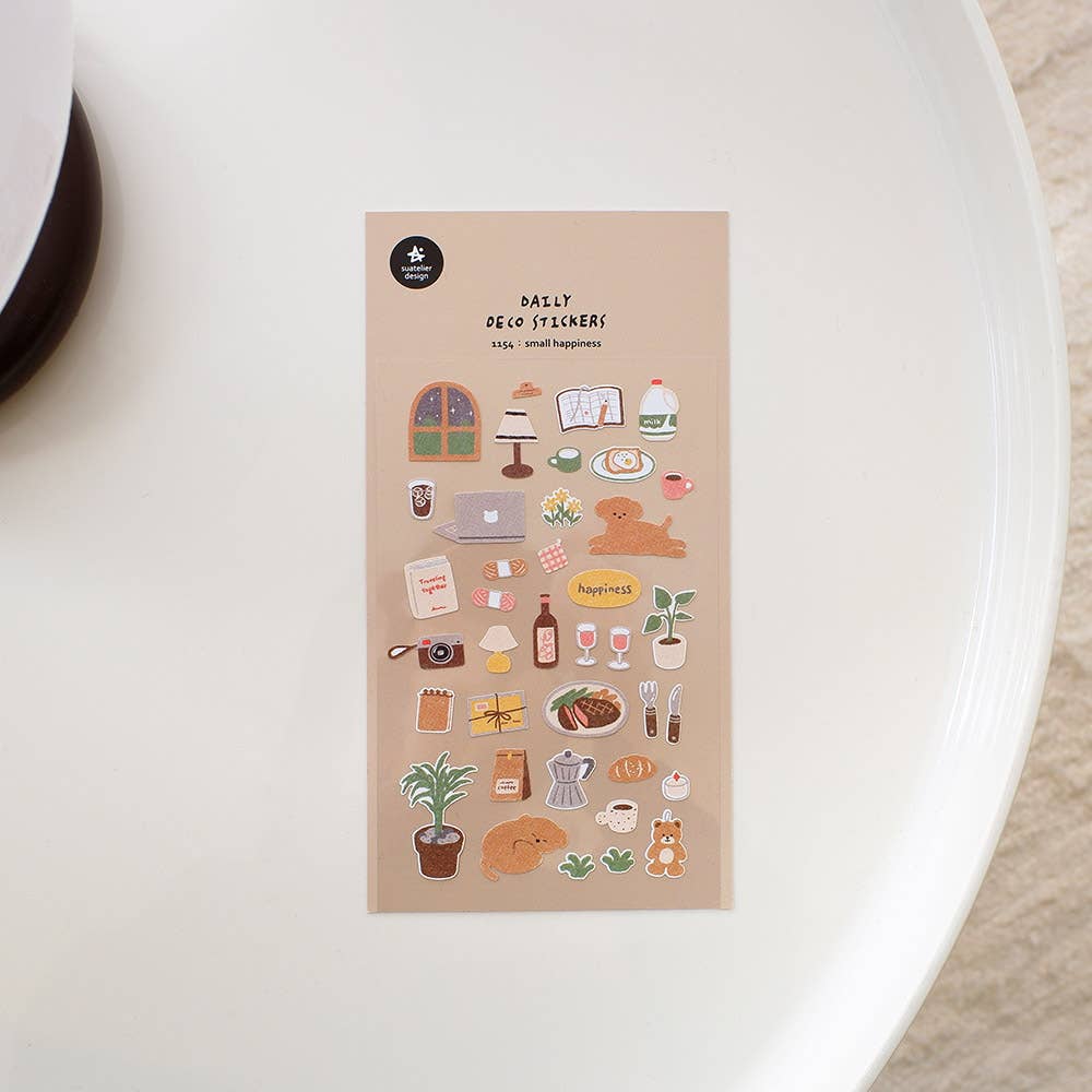 Pack of daily life Suatelier stickers on a white surface
