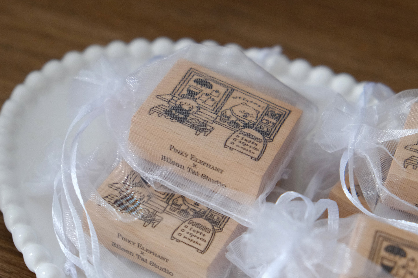 Wooden Eileen Tai bear stamps on a white plate