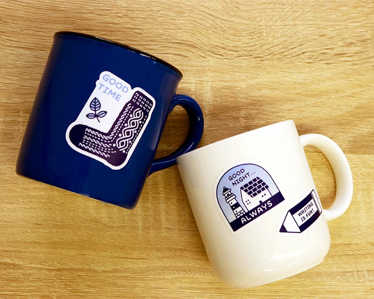 Sanby x Eric Small Things Multi-Stickers on a couple mugs