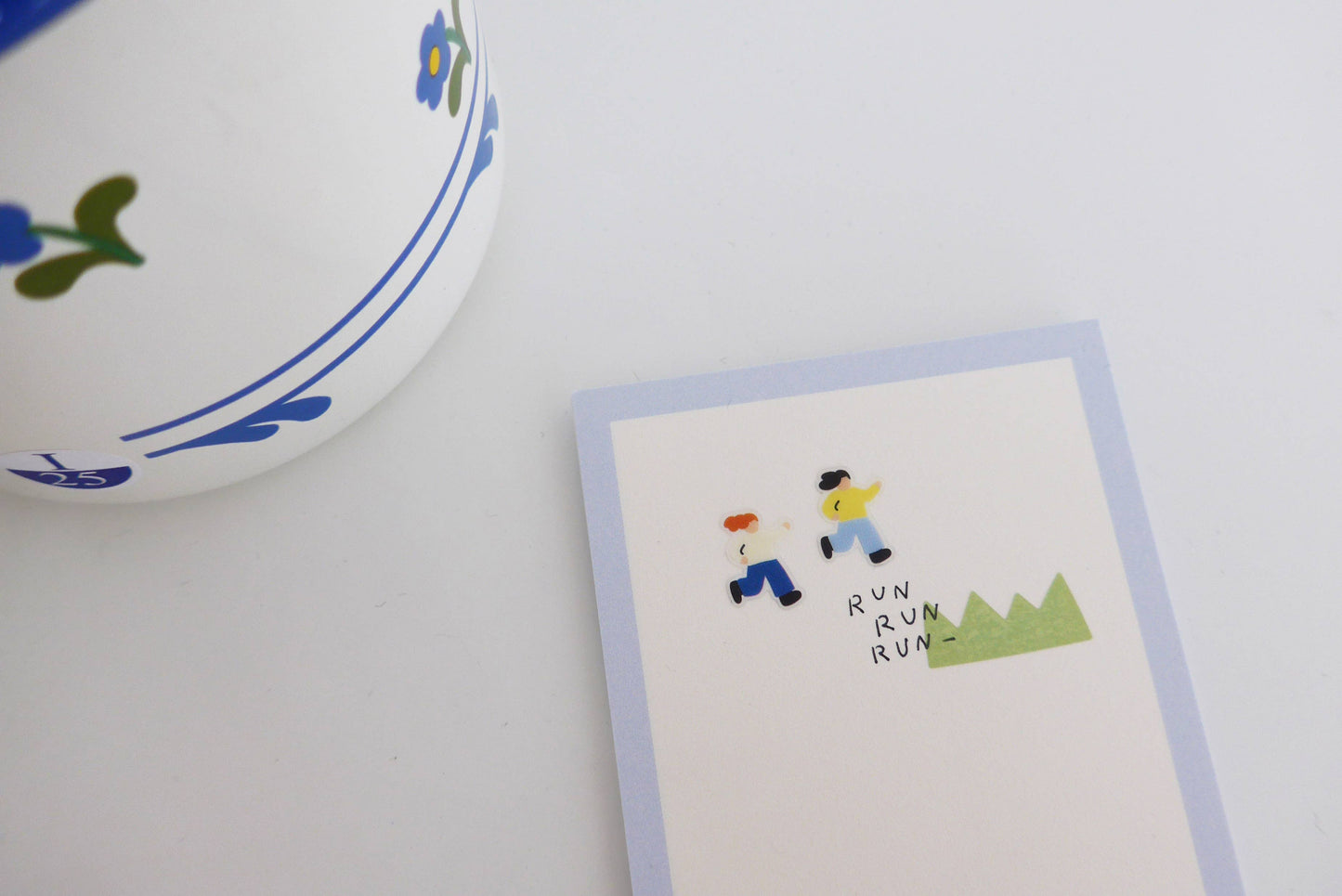 Small card with two children running illustration and 'RUN RUN' text next to a decorative bowl.