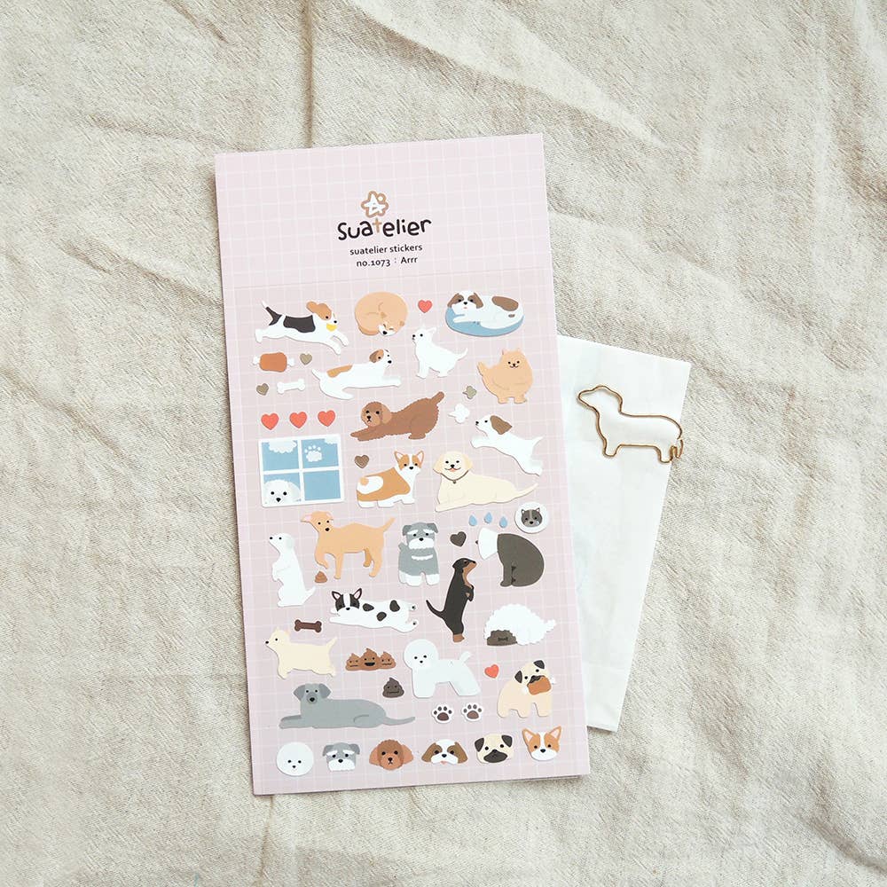 Suatelier sticker sheet of animal stickers with a pink border on a textured surface