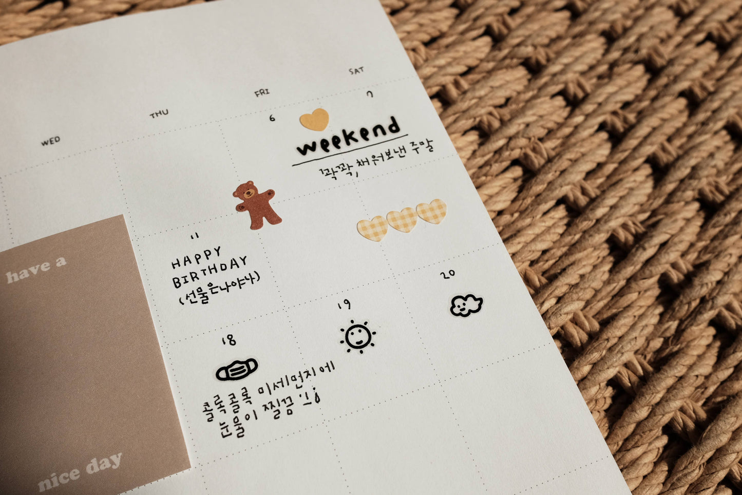 Sheet of Suatelier stickers with various designs on a textured surface