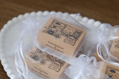 Wooden Eileen Tai bear stamps on a white plate