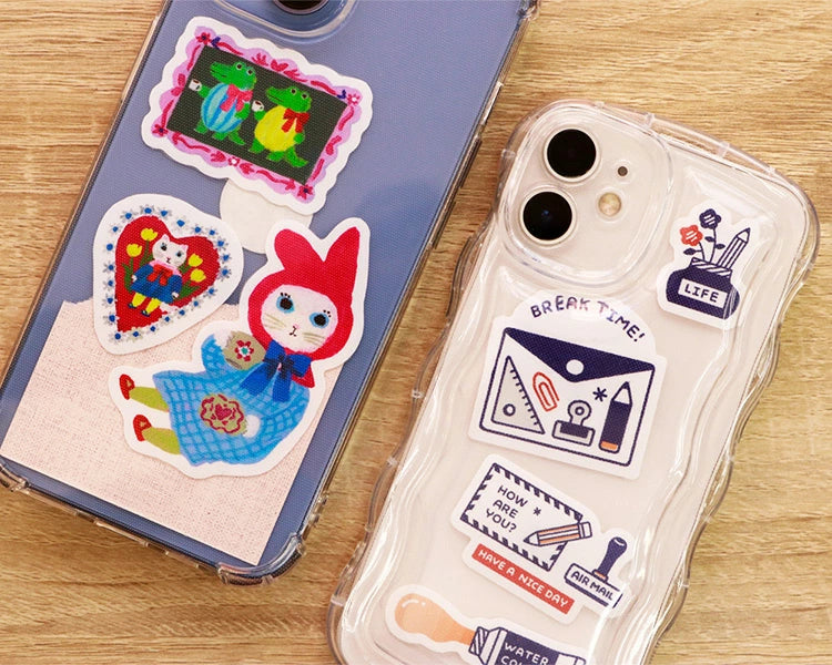 Sanby x Yumi Kitagishi and Eric Small Things Stickers on the back of mobile phone cases